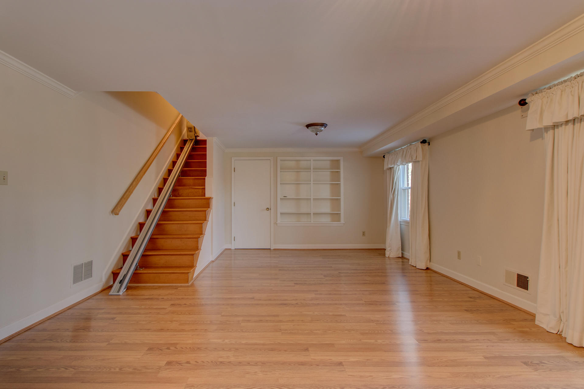 5123 Falcon Ridge Road Roanoke, VA 24018 - Photo 27 of 32 a view of an empty room with wooden floor and stairs