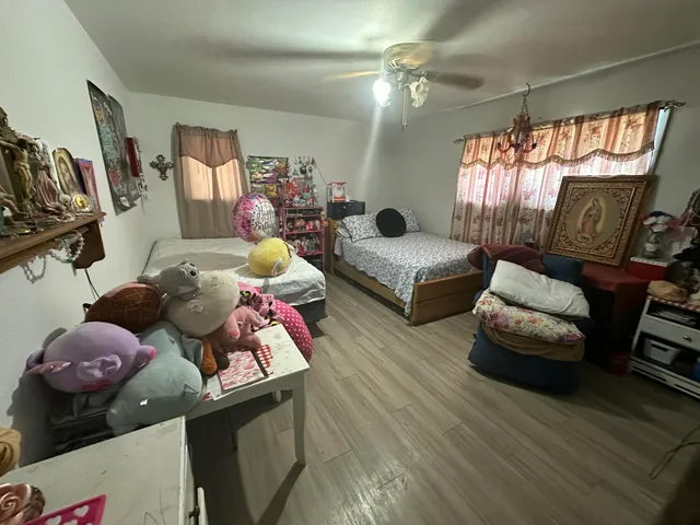 a bedroom with furniture and a window