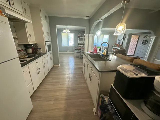 a kitchen with granite countertop lots of counter space and stainless steel appliances