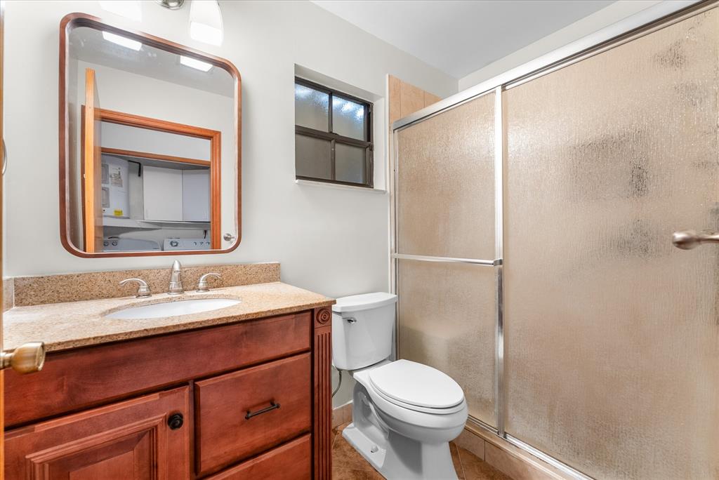 5051 Southwest 142nd Place Miami, FL 33175 - Photo 18 of 30 a bathroom with a toilet sink and mirror