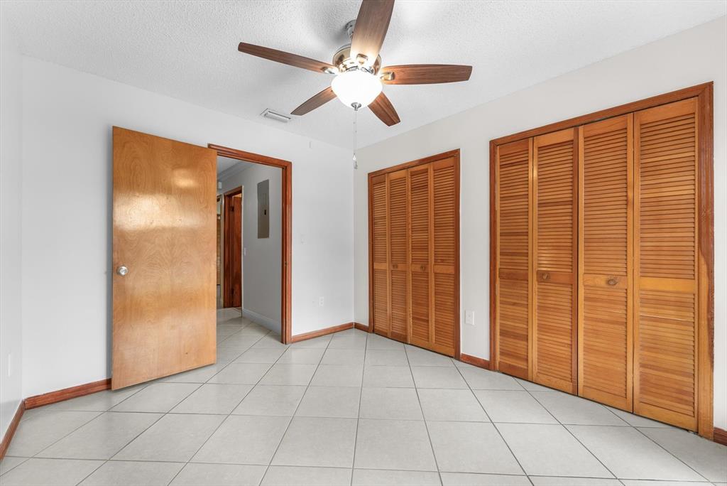 5051 Southwest 142nd Place Miami, FL 33175 - Photo 19 of 30 an empty room with chandelier fan