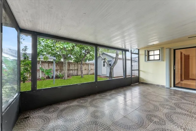 a view of an empty room with a large window