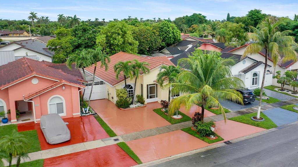 5051 Southwest 142nd Place Miami, FL 33175 - Photo 26 of 30 an aerial view of residential houses with yard