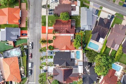 an aerial view of city and green space