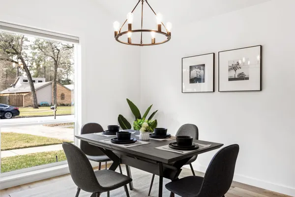 a view of a dining room with furniture window and outside view