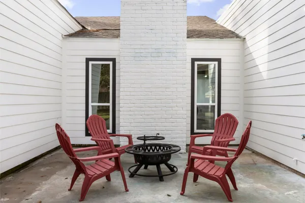 a view of a house with a yard and garage