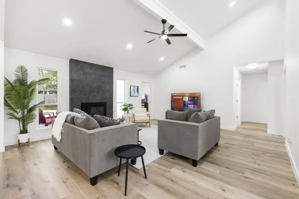 a living room with furniture and a fireplace
