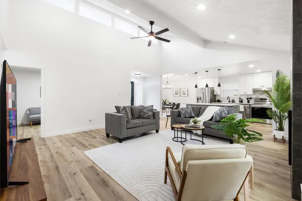 a living room with furniture and a flat screen tv