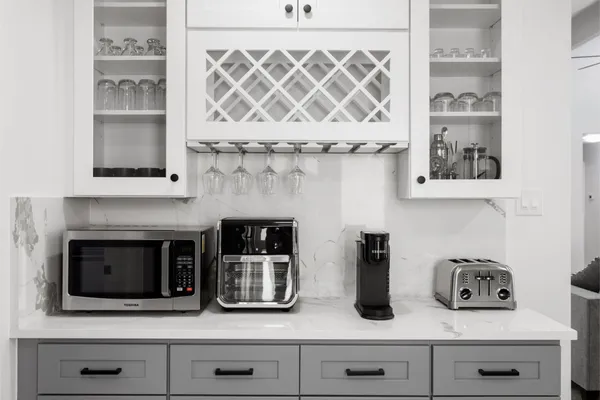 a kitchen with a stove and cabinets