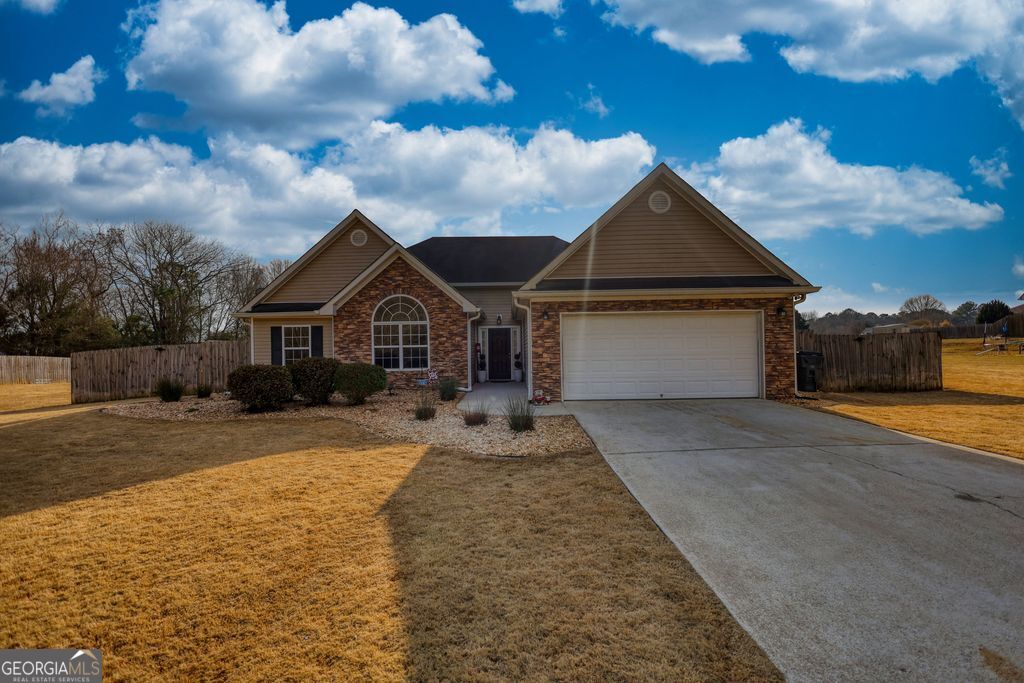 a front view of a house with yard