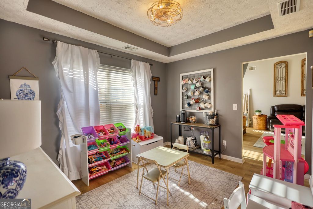 4610 Atlanta Highway Rutledge, GA 30663 - Photo 14 of 32 a living room with furniture and a window