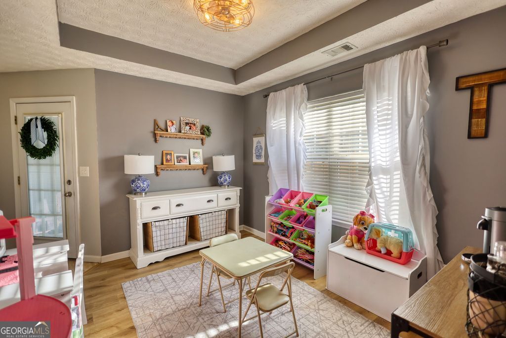 4610 Atlanta Highway Rutledge, GA 30663 - Photo 15 of 32 a room with furniture a rug and a window