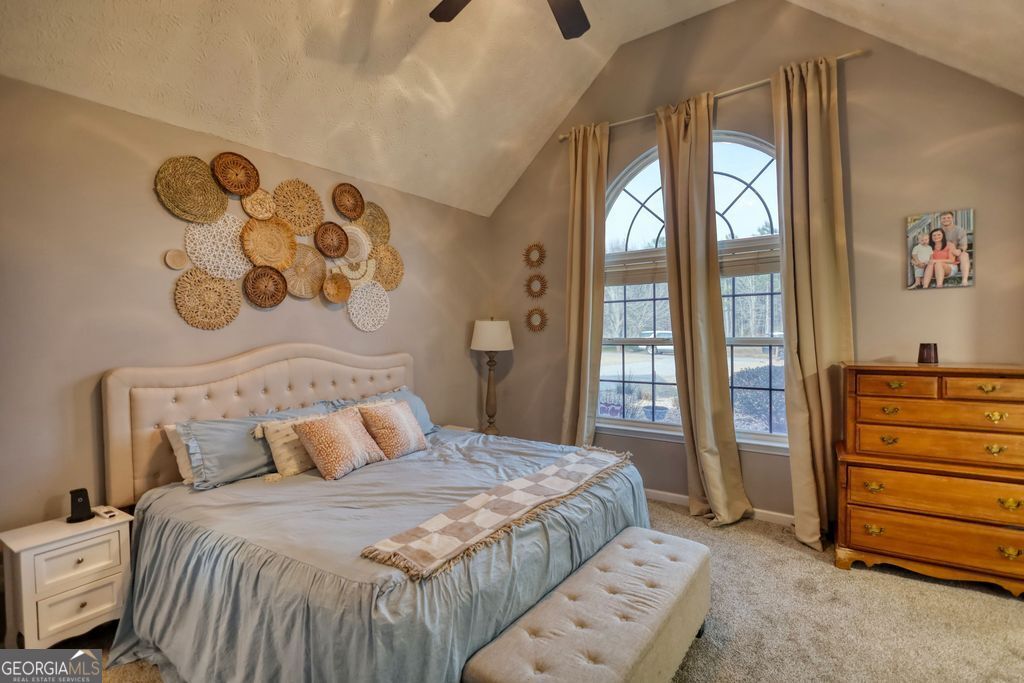 4610 Atlanta Highway Rutledge, GA 30663 - Photo 16 of 32 a bedroom with a bed and a window