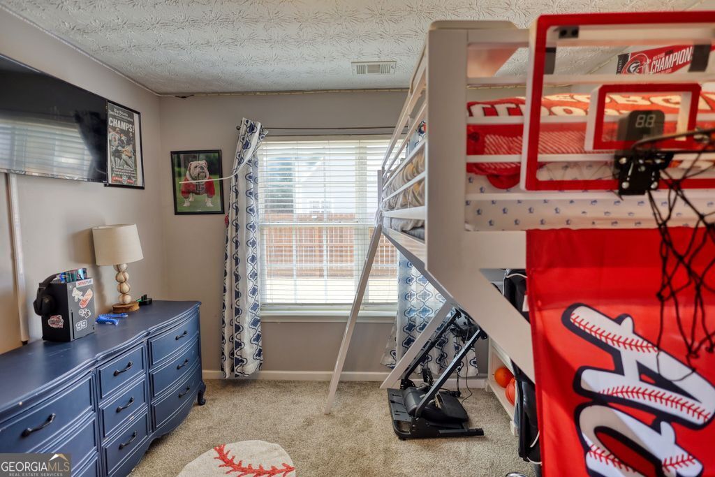4610 Atlanta Highway Rutledge, GA 30663 - Photo 22 of 32 a bedroom with furniture and a window