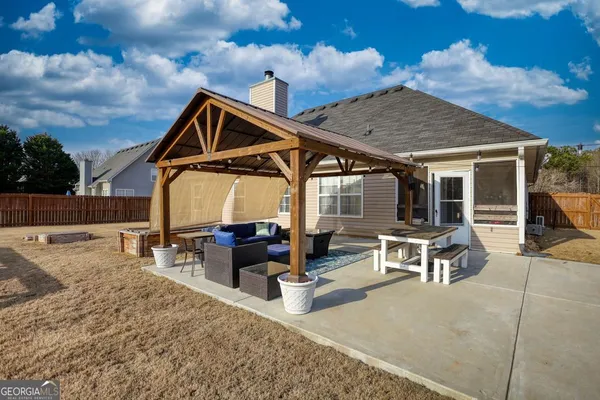 a backyard of a house with seating space
