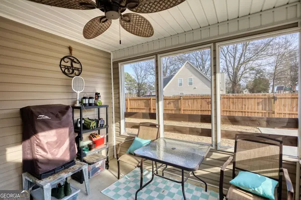 a view of a dining room with furniture window and outside view