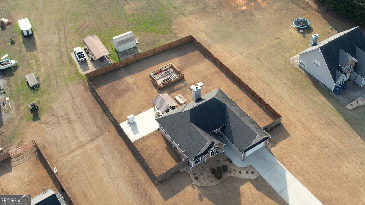 4610 Atlanta Highway Rutledge, GA 30663 - Photo 31 of 32 a living room with furniture and a flat screen tv