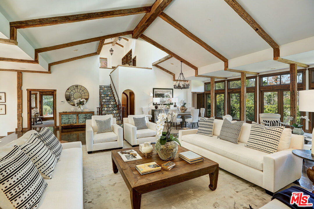 10960 Bellagio Road Los Angeles, CA 90077 - Photo 6 of 22 a living room with fireplace furniture and a large window