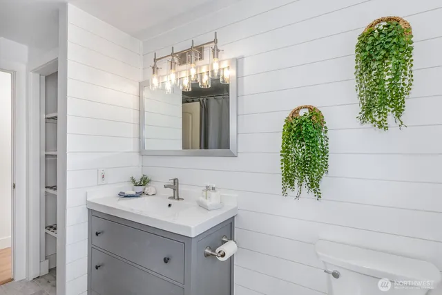 an aerial view of a house with a yard and trees
