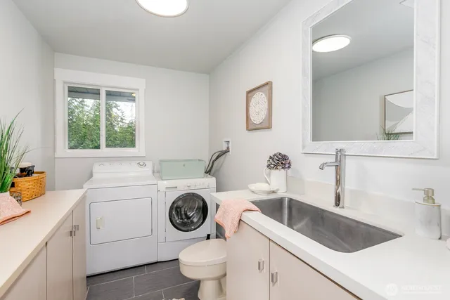 a view of a house with wooden deck