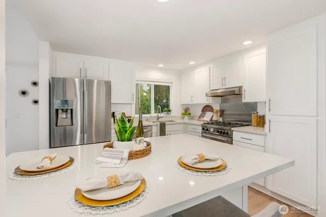 a living room with furniture a fireplace and a floor to ceiling window