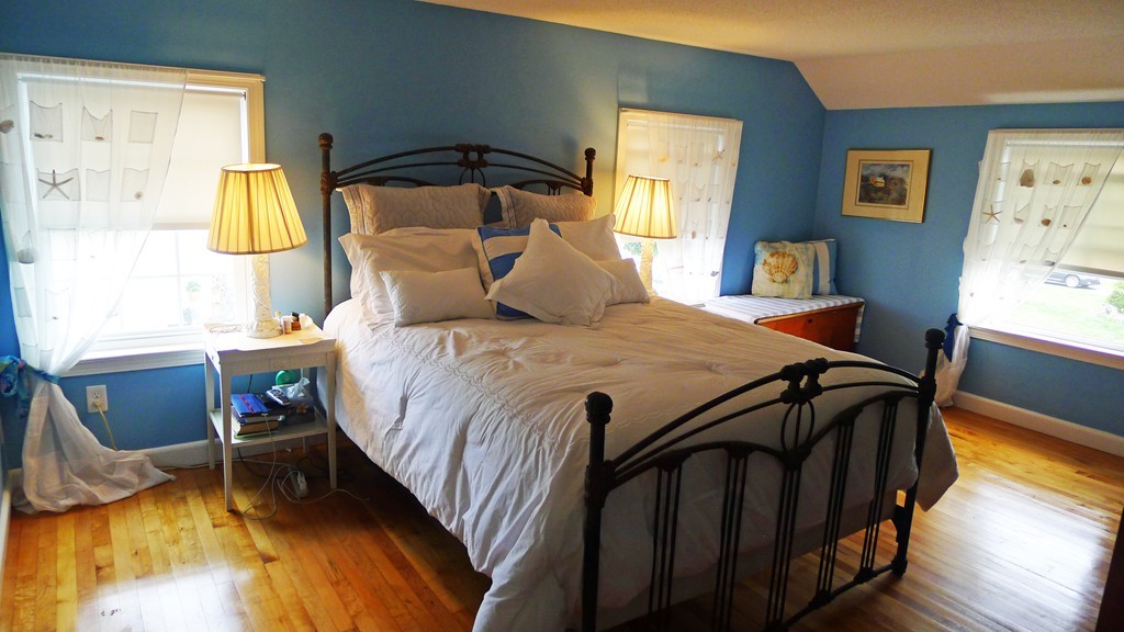 40 Wayside Street Springfield, MA 01118 - Photo 20 of 30 a bedroom with a bed and wooden floor