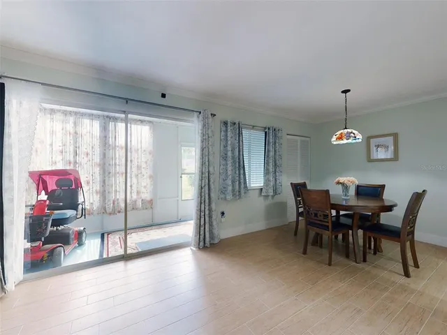 a view of a livingroom with furniture wooden floor and a window