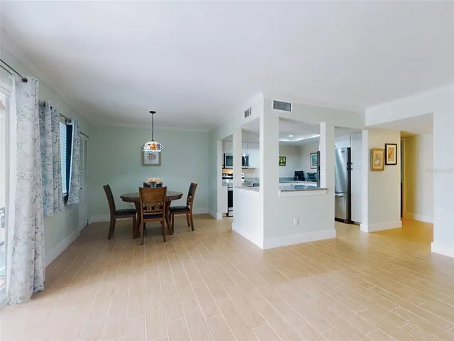 a view of kitchen with furniture and wooden floor