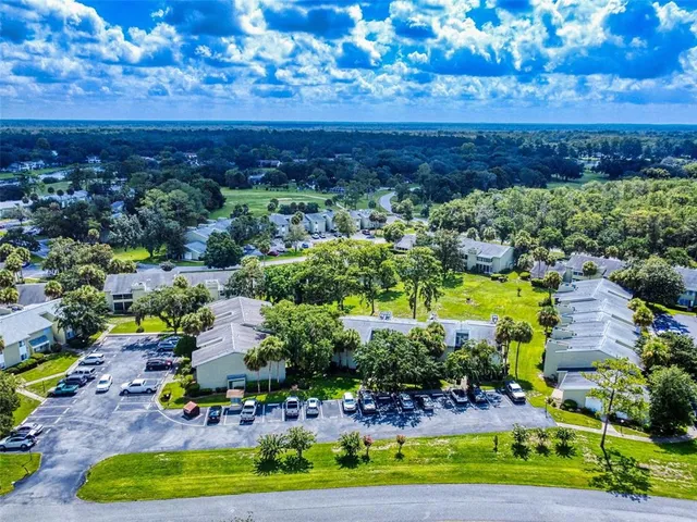 an aerial view of residential house with outdoor space and swimming pool