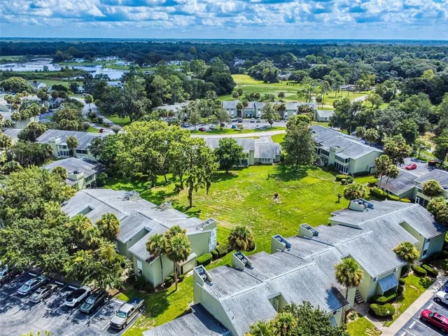a view of a city with lots of residential buildings ocean and mountain view