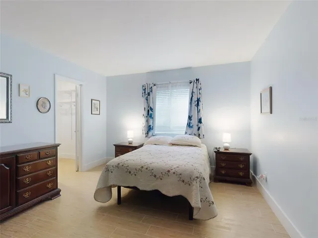 a bedroom with a bed and a dresser