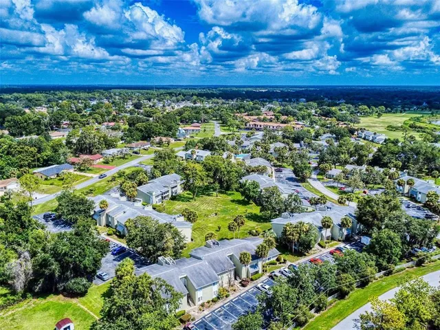 a view of a swimming pool with a yard
