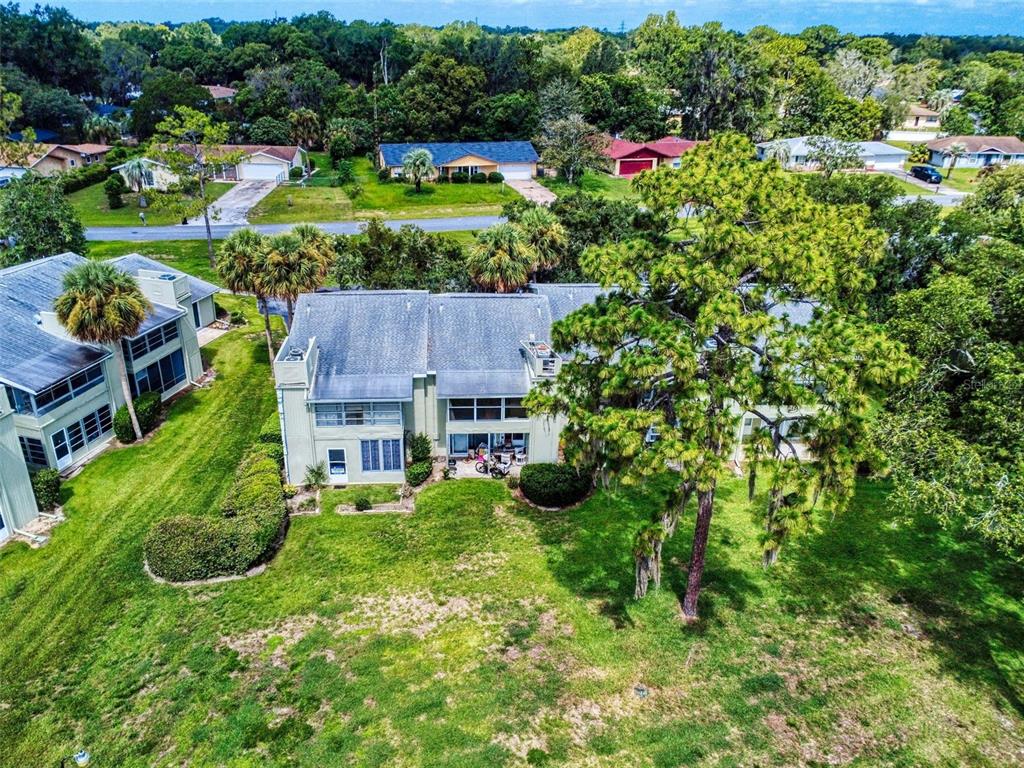 588 Bahia Circle, Unit A Ocala, FL 34472 - Photo 46 of 49 an aerial view of a house with a yard and outdoor seating