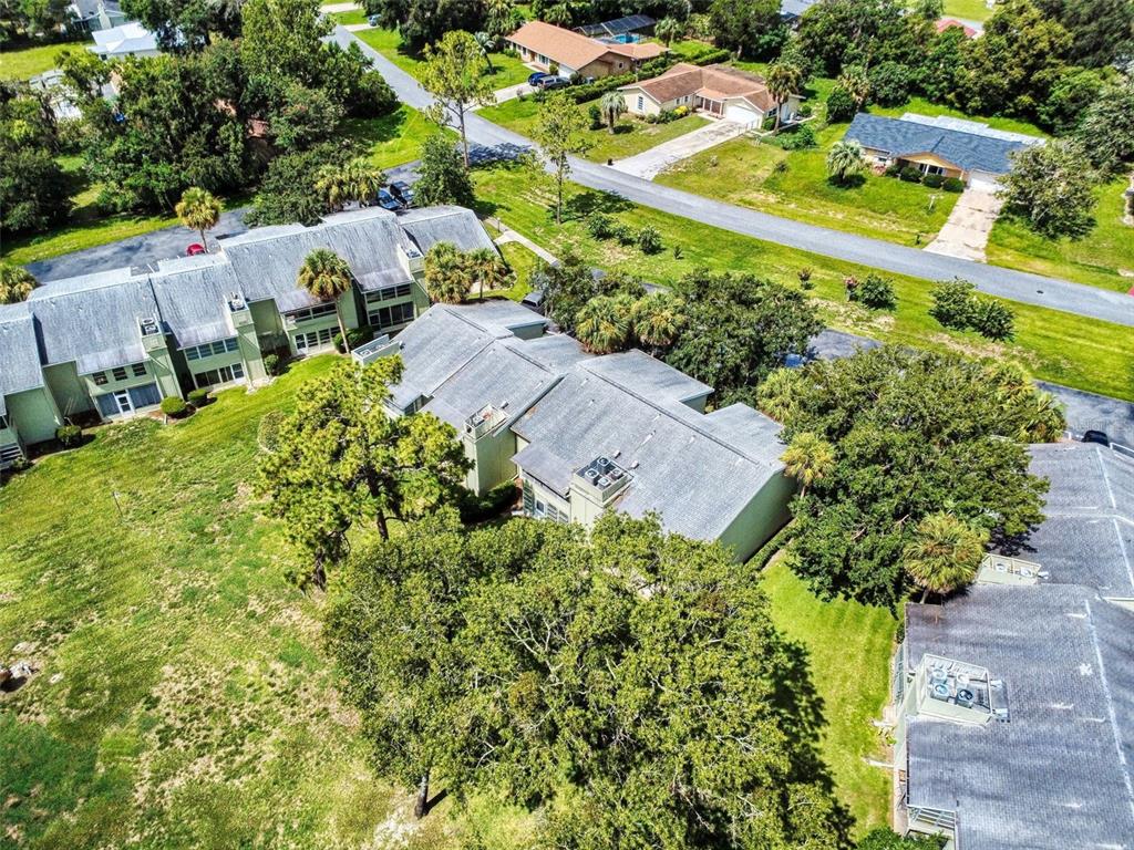 588 Bahia Circle, Unit A Ocala, FL 34472 - Photo 47 of 49 an aerial view of a house with a garden
