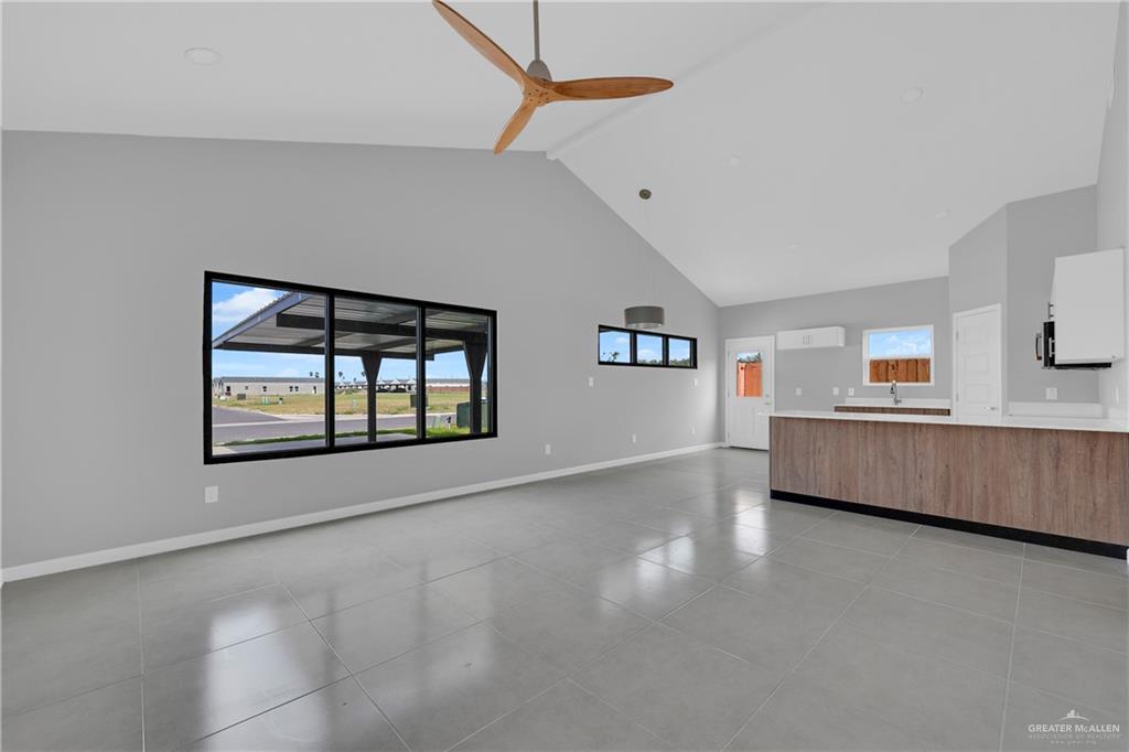 700 Oriole Road, Unit 1 Weslaco, TX 78596 - Photo 4 of 11 a view of an empty room with window and wooden floor