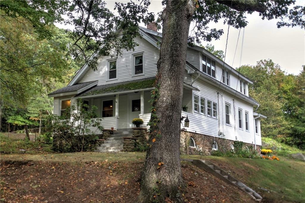 811 Dogburn Road Orange, CT 06477 - Photo 1 of 1 a front view of a house with garden
