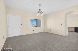 7701 West Robindale Road, Unit 277 Las Vegas, NV 89113 - Photo 24 of 33 An inviting dining area offers plush carpeting, a centered chandelier, and a bright view
through a wide window. Door leading to balcony.