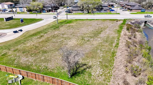 a view of a swimming pool with a yard and sitting area