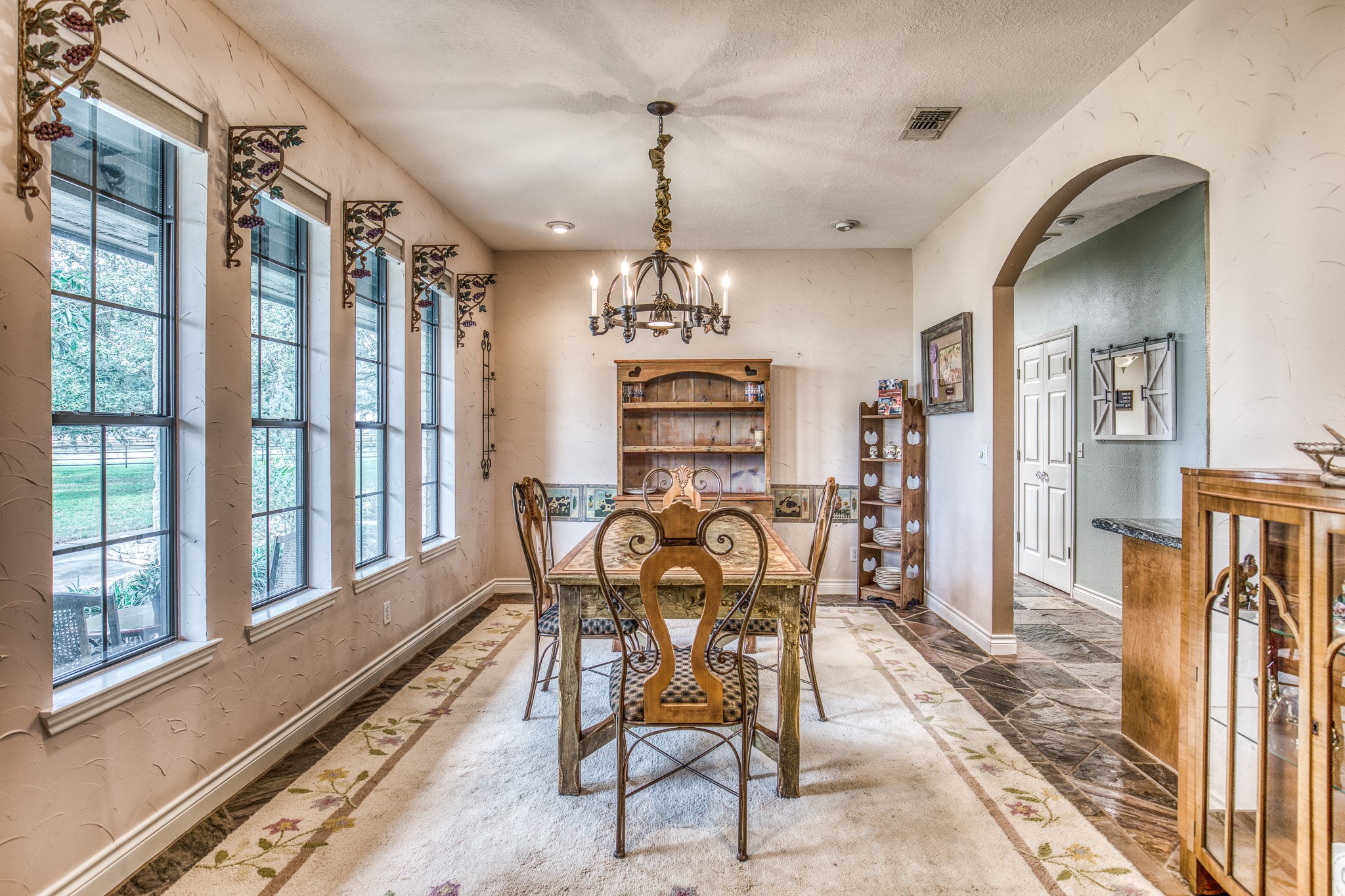 16450 Mathis Road Hockley, TX 77447 - Photo 19 of 39 a view of a dining room with furniture window and wooden floor
