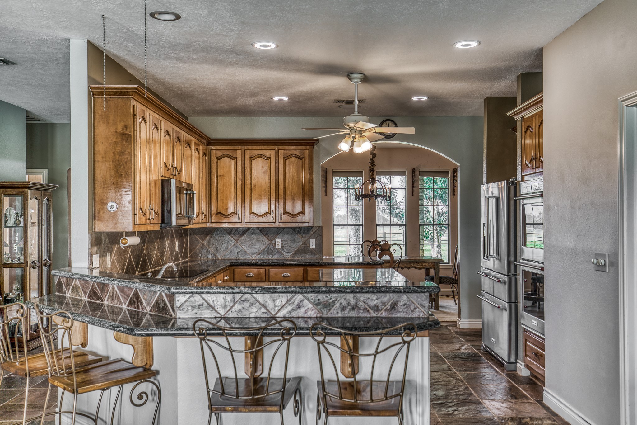 16450 Mathis Road Hockley, TX 77447 - Photo 20 of 39 a kitchen with a stove a sink and a refrigerator