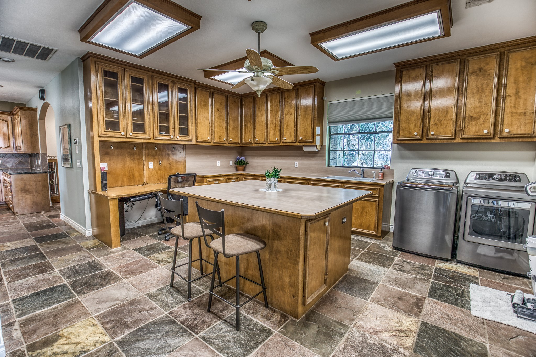 16450 Mathis Road Hockley, TX 77447 - Photo 21 of 39 a kitchen with a sink appliances and cabinets