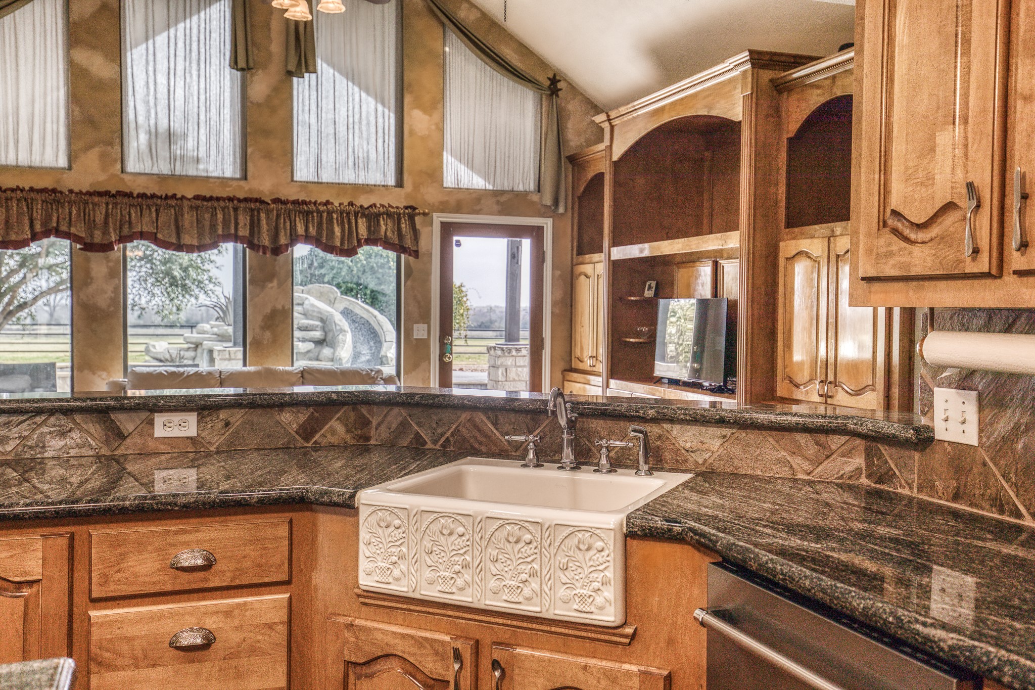 16450 Mathis Road Hockley, TX 77447 - Photo 22 of 39 a bathroom with a granite countertop sink and a window
