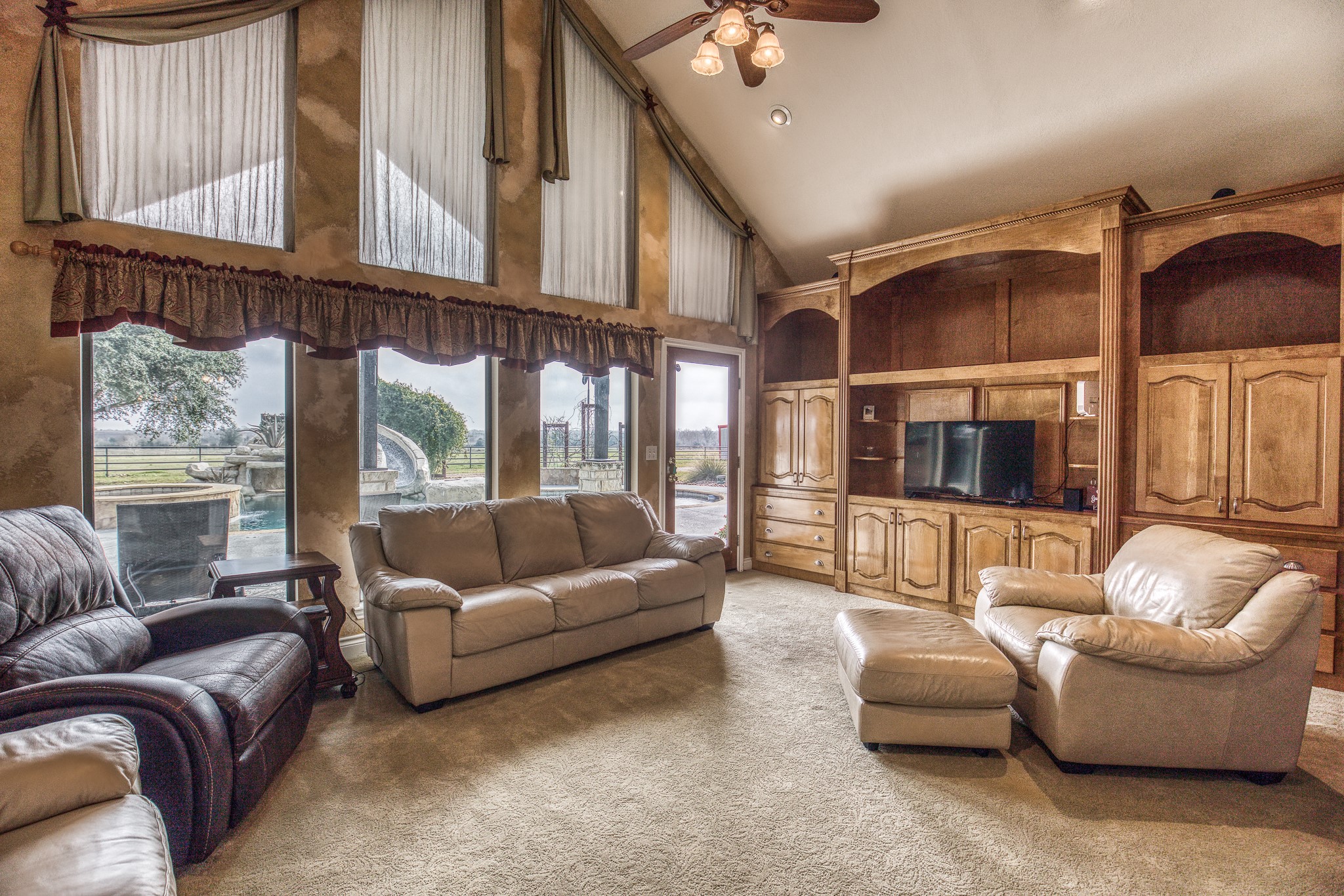 16450 Mathis Road Hockley, TX 77447 - Photo 23 of 39 a living room with furniture and a large window