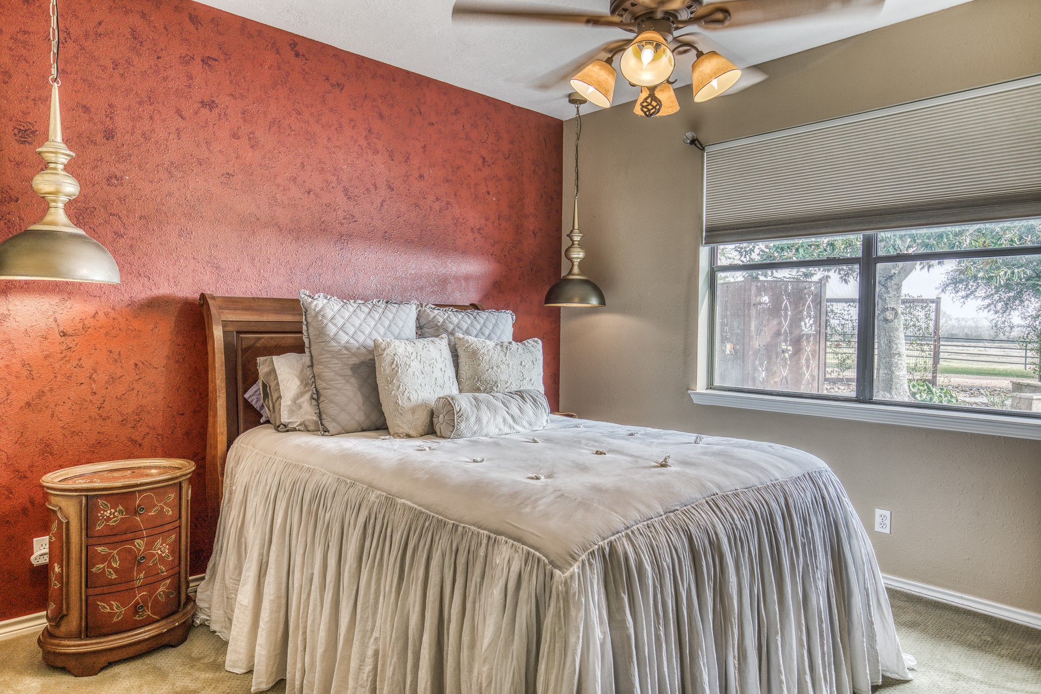 16450 Mathis Road Hockley, TX 77447 - Photo 24 of 39 a bedroom with a bed and a chandelier