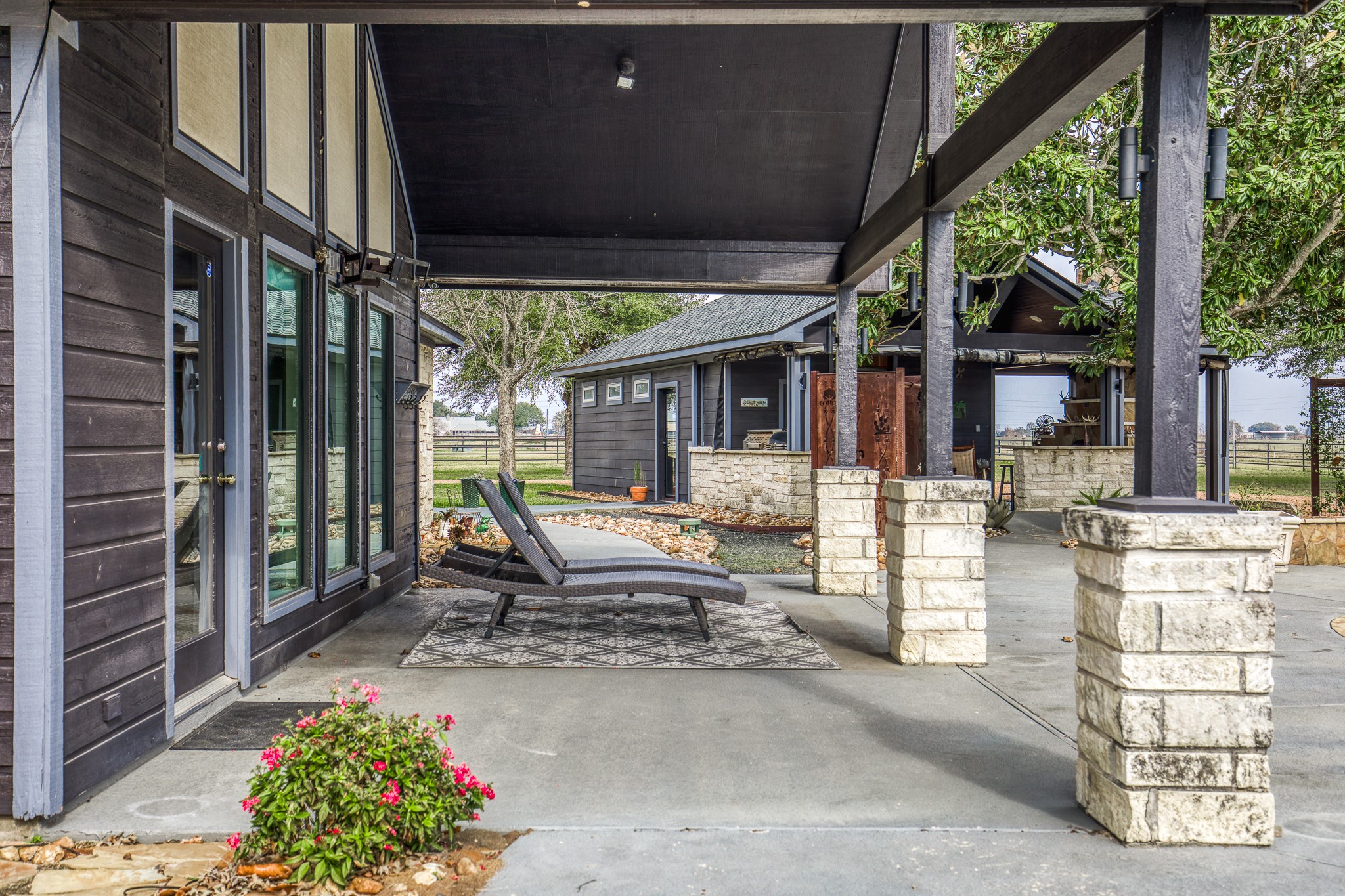16450 Mathis Road Hockley, TX 77447 - Photo 29 of 39 a building outdoor space with patio furniture and potted plants