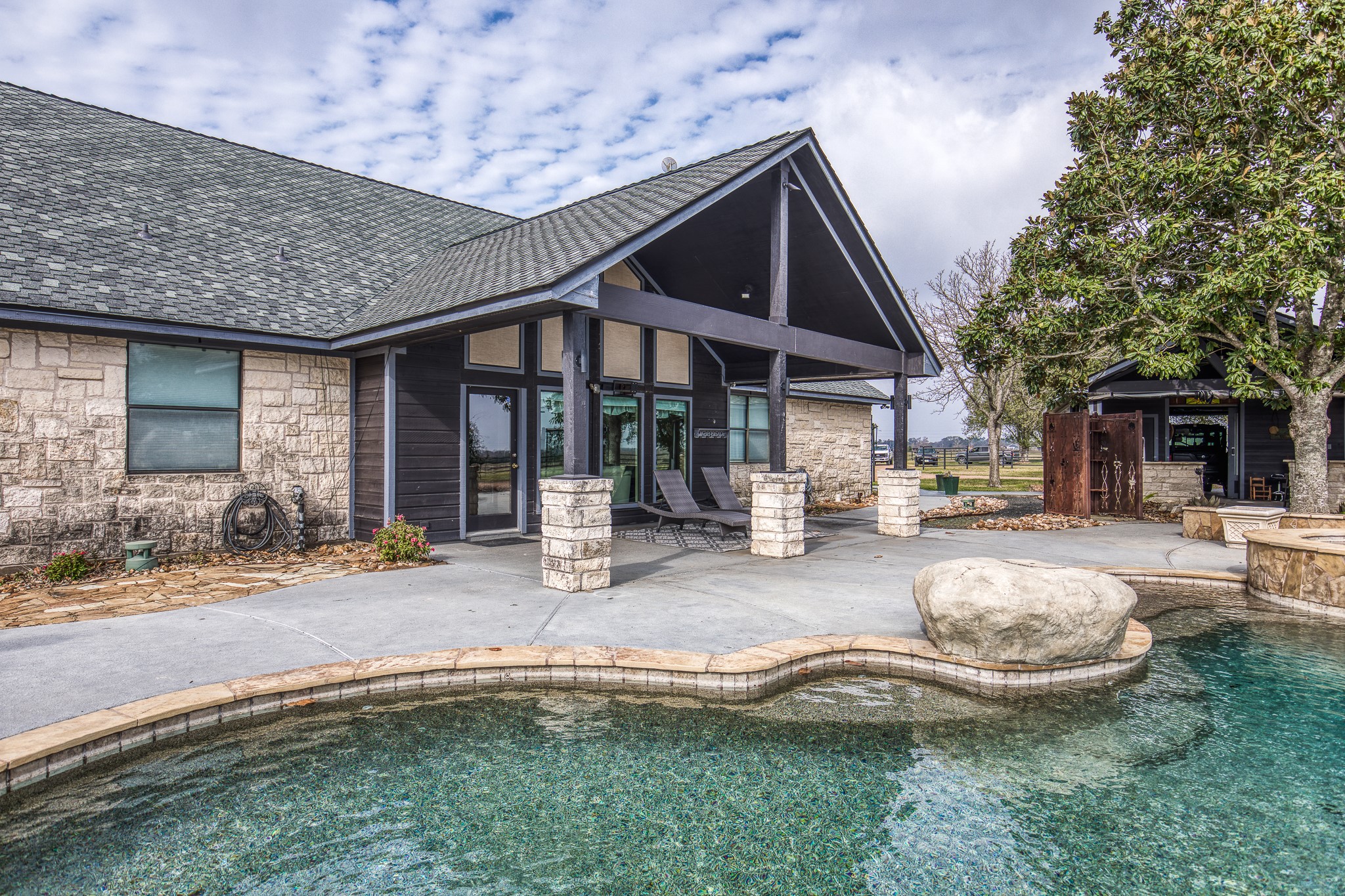 16450 Mathis Road Hockley, TX 77447 - Photo 30 of 39 a front view of a house with swimming pool and porch