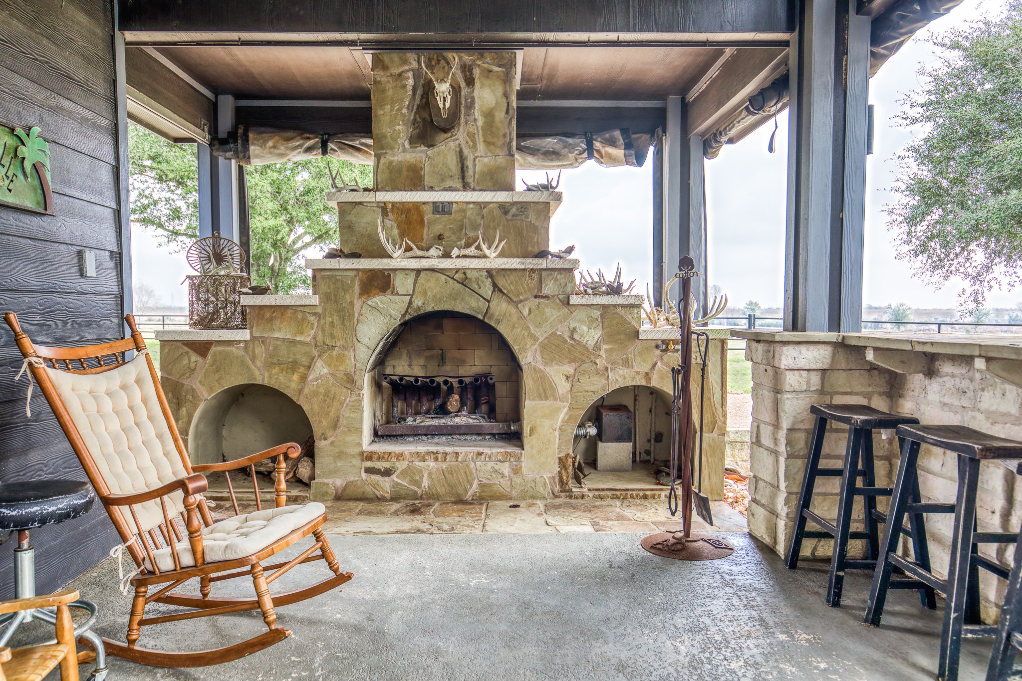 16450 Mathis Road Hockley, TX 77447 - Photo 34 of 39 a living room with furniture and a fireplace