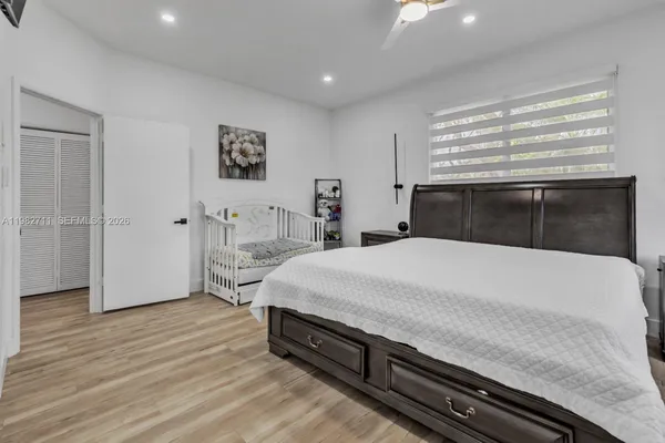 a spacious bathroom with a bathtub and shower