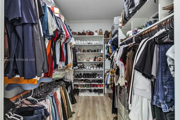 a bedroom with a bed and a table