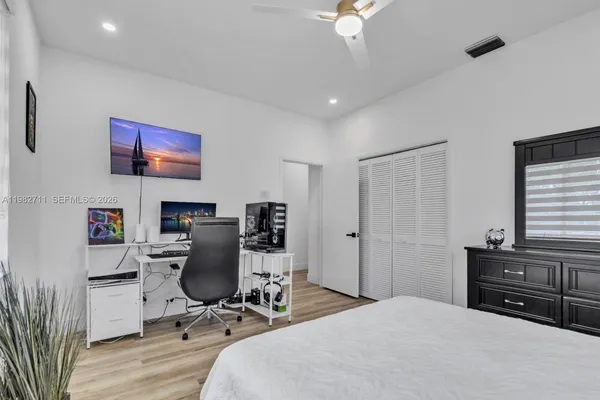 a bathroom with a granite countertop sink a toilet and a bathtub
